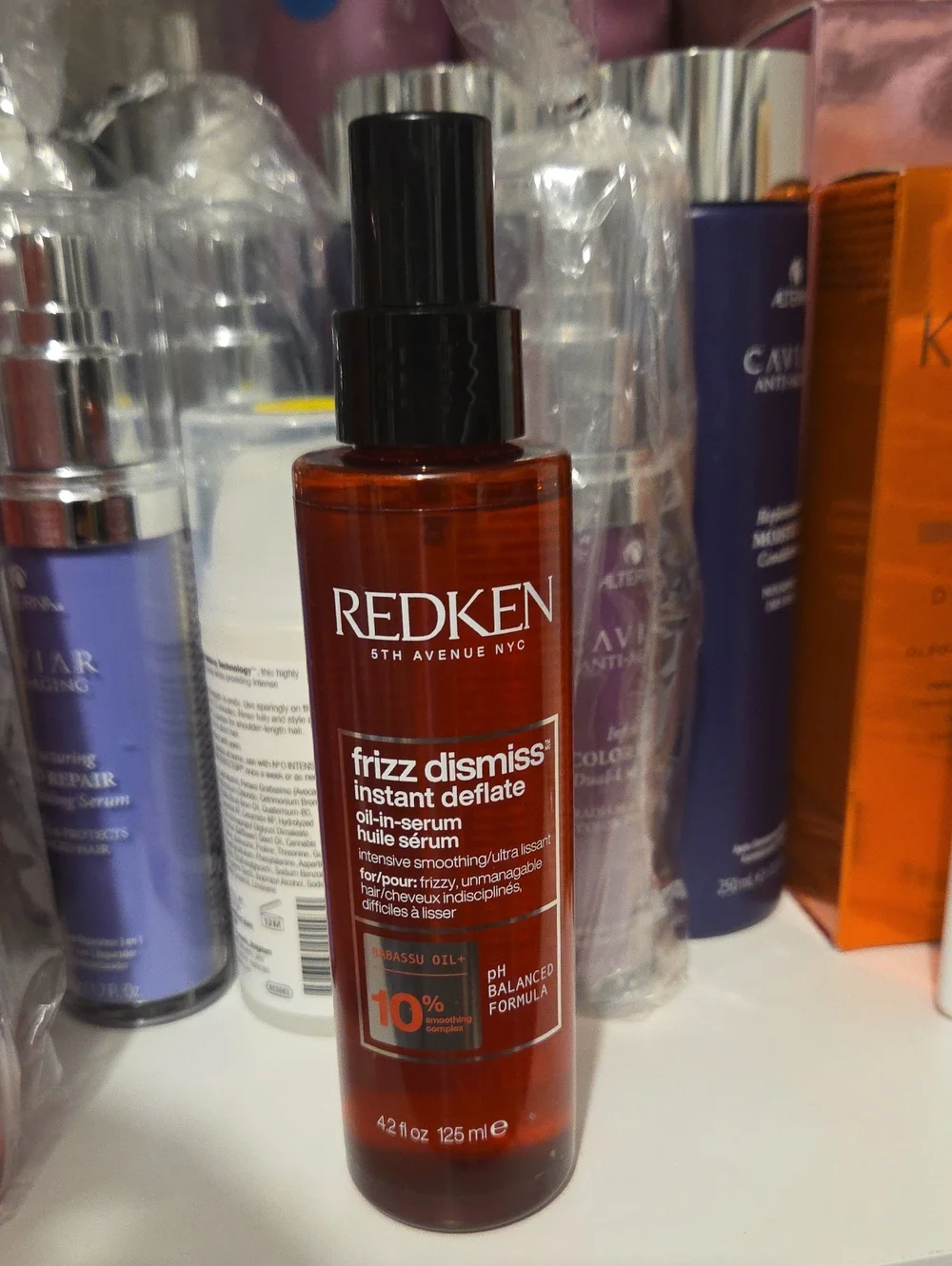 Redken Frizz Dismiss Instant Deflate Oil-In-Serum — amber red bottle